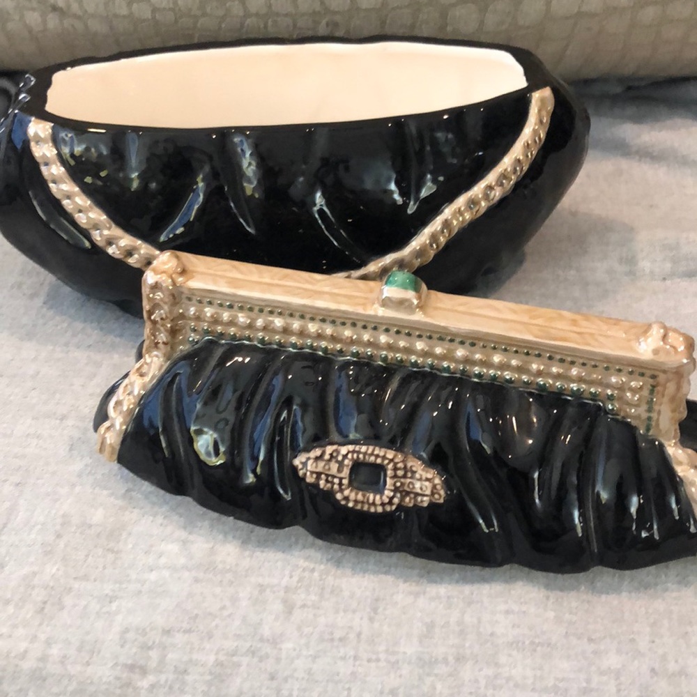 Decorative purse shaped jar.
